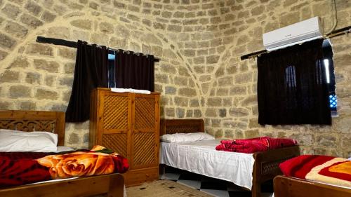 Ένα ή περισσότερα κρεβάτια σε δωμάτιο στο Zad Elmosafer Villa - Tunis Village
