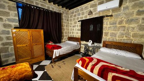 Ένα ή περισσότερα κρεβάτια σε δωμάτιο στο Zad Elmosafer Villa - Tunis Village