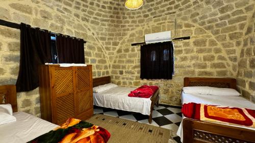 Ένα ή περισσότερα κρεβάτια σε δωμάτιο στο Zad Elmosafer Villa - Tunis Village