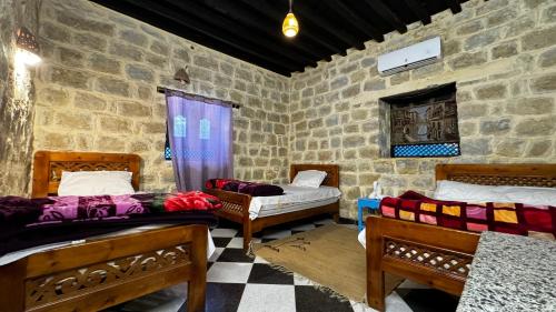 Ένα ή περισσότερα κρεβάτια σε δωμάτιο στο Zad Elmosafer Villa - Tunis Village
