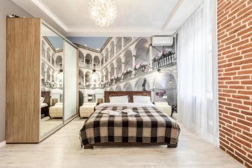 Кровать или кровати в номере Apartments VIP AVALON