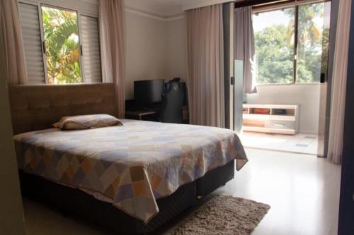 Postel nebo postele na pokoji v ubytování Residencial JOCKEY