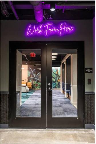 a purple sign above the doors of a building at King Bed, Parking, Near Stadium in Cincinnati