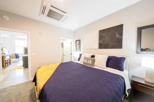 a bedroom with a bed and a desk and a room at King Bed, Parking, Near Stadium in Cincinnati
