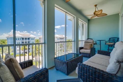 a living room with a couch and chairs on a balcony at Penthouse in Paradise! Sunrise views in Margaritaville, 2 miles to beaches & AMI! in Bradenton