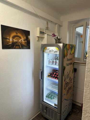 a refrigerator with its door open in a room at Pauli Hostel in Hamburg