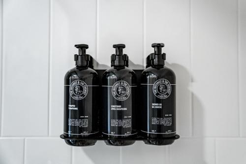 a group of four bottles sitting on a shelf at Hotel Sylva in Sylva