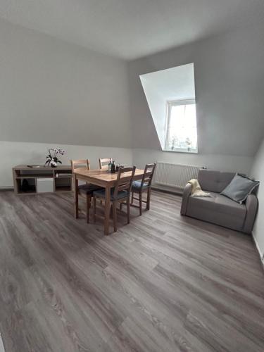 a living room with a table and a couch at U Drahusky in Prague