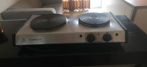 a machine with two speakers on top of it at FLATS - DUO JK in Sao Jose do Rio Preto
