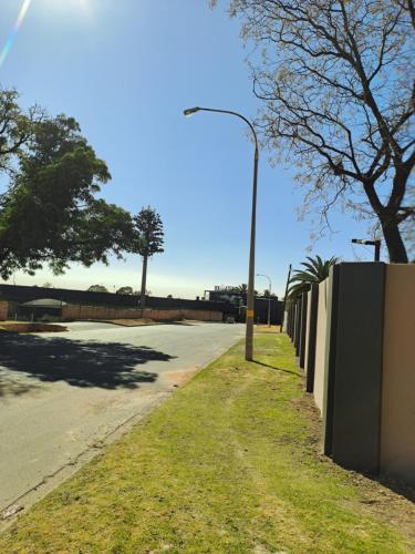 a street light on the side of a road at Randhart guesthouse in Alberton