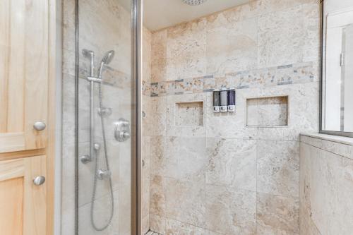 a bathroom with a shower with a glass door at 8 Mi to Jacksonville Oregon Getaway with Deck! in Jacksonville