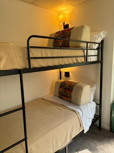 a room with two bunk beds with a pillow at Welcome to Camp Sycamore in Pittsburgh
