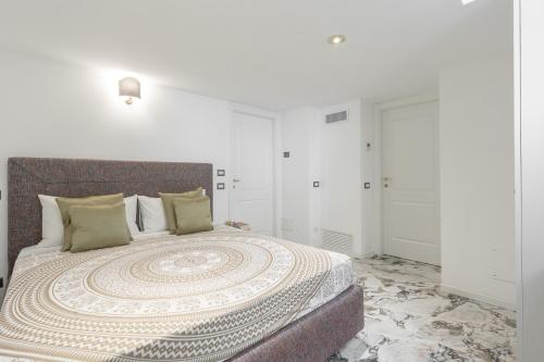 a bedroom with a large bed with a design on it at Duomo Smart Suites in Milan