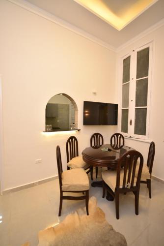 a dining room with a table and chairs at family suites cairo downtown in Cairo