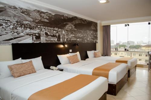 Postel nebo postele na pokoji v ubytování Hotel María Luisa