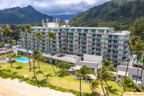an aerial view of a resort with palm trees at Luxury One-Bedroom Apartment with Ocean View in Hauula