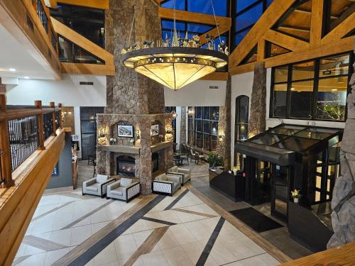 an indoor lobby with a fireplace and a chandelier at Ski-in-out, Canyons, Westgate, King, Breakfast, HT in Park City