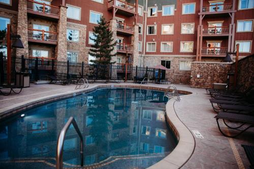 a swimming pool in the middle of a apartment complex at Ski-in-out, Canyons, Westgate, King, Breakfast, HT in Park City