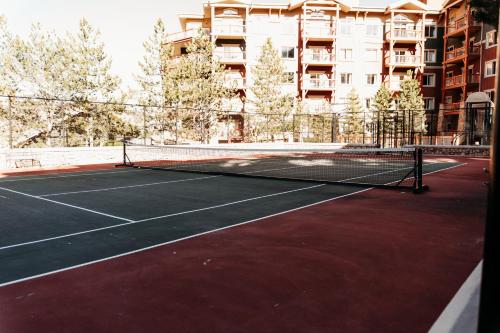 a tennis court with a net in front of a building at Ski-in-out, Canyons, Westgate, King, Breakfast, HT in Park City