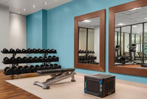 a fitness room with a gym with mirrors at DoubleTree by Hilton Hartford Downtown in Hartford