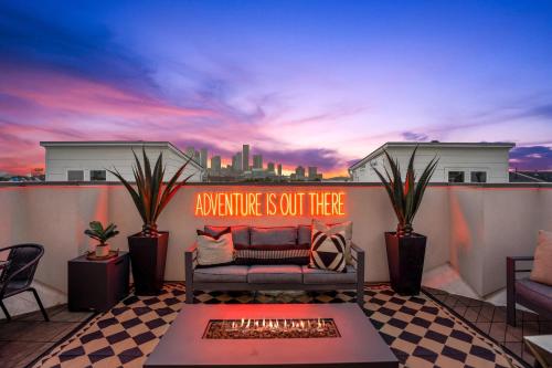 a couch on a balcony with a signurance is out there at Luxury Downtown Getaway with Breathtaking Views in Houston