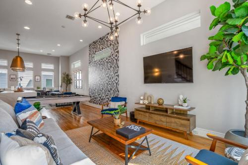 a living room with a couch and a table at Luxury Downtown Getaway with Breathtaking Views in Houston