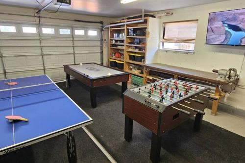 two ping pong tables in a room with a chessboard at Cliff Views - Hot Tub - SUPs - Boat Parking - Sleeps 16 in Page