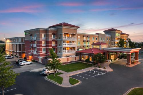 an aerial view of a hotel with a parking lot at Holiday Inn Hotel & Suites Maple Grove Northwest Minneapolis-Arbor Lakes by IHG in Maple Grove