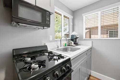 a kitchen with a stove and a sink at Big Bear Frontier in Big Bear Lake