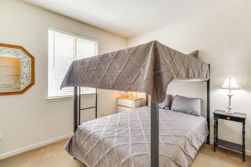 a bedroom with a bed with an umbrella on it at Reno Home with Game Room 5 Mi to Downtown! in Reno