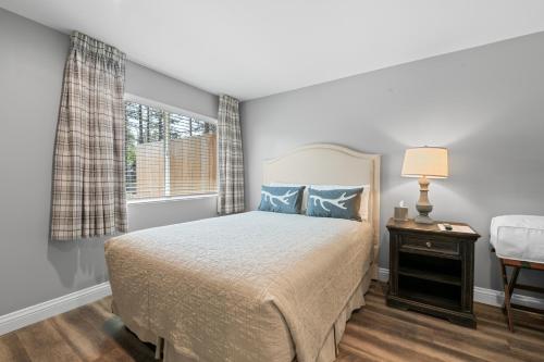 a bedroom with a bed and a window at Big Bear Frontier in Big Bear Lake