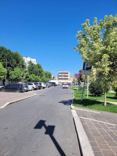 a shadow of a cross on a street at Cavour3 in Nettuno