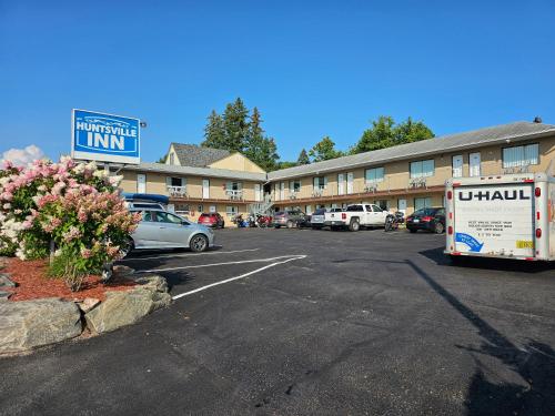 a parking lot in front of a hotel at Huntsville Inn in Huntsville