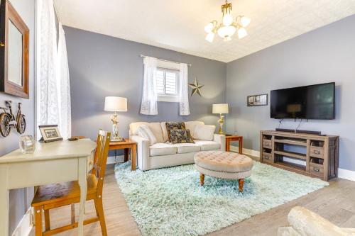 a living room with a couch and a tv at Dog-Friendly Dayton Home 1 Mi to Downtown! in Dayton
