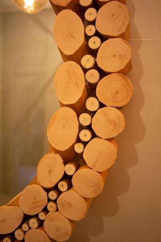 a bunch of wood on the side of a wall at Dar Salam Palm - Guest Choice Award 2024 in Marrakech