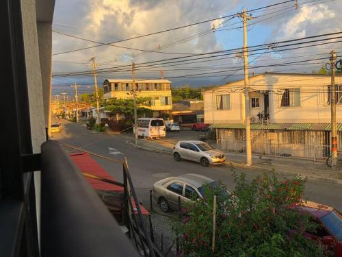 a view from a balcony of a street with cars at Habitaciones Armenia Quindio in Armenia