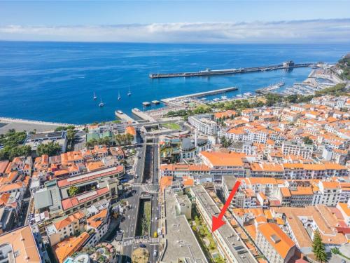 an aerial view of a city and the ocean at Turquesa in Funchal