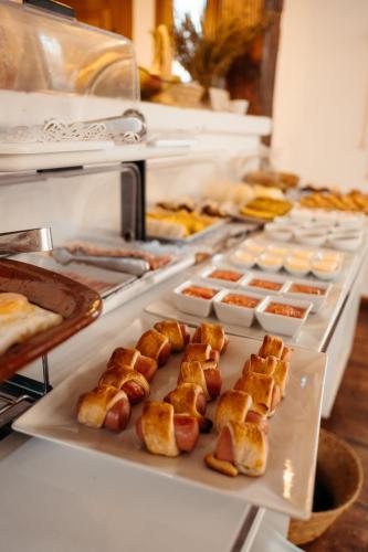 a buffet line with bread and pastries on display at Cortijo Los Malenos in Agua Amarga