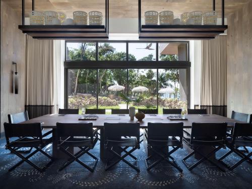 a large dining room with a large table and chairs at Kimpton - Grand Roatan Resort and Spa in West Bay