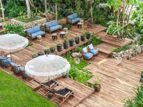 an aerial view of a patio with chairs and tables at Kimpton - Grand Roatan Resort and Spa in West Bay