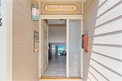 a beach house entrance with a beach house sign at Picturesque Perfection in Leucadia Encinitas in Encinitas
