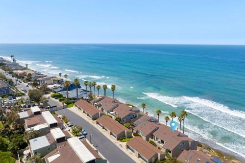 an aerial view of a beach with palm trees and houses at Picturesque Perfection in Leucadia Encinitas in Encinitas