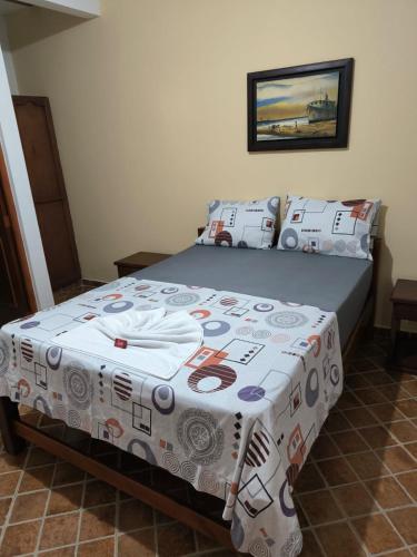 Una cama o camas en una habitación de Hotel Palmarito