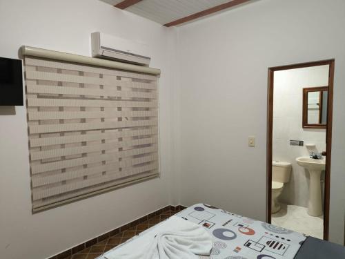 Una cama o camas en una habitación de Hotel Palmarito