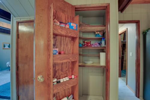 a walk in pantry with a wooden door at Rhododendron Family Cabin Hot Tub and Deck! in Rhododendron