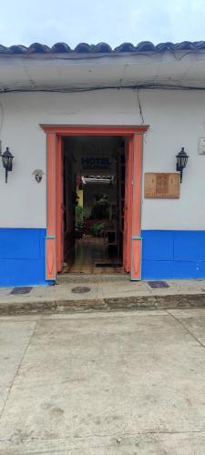an open door of a building with at Hotel Colonial in Jardin