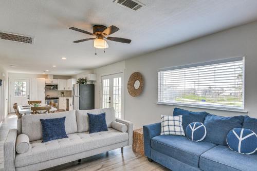 a living room with a couch and a ceiling fan at Walk to Sand Surfside Beach Getaway with Deck in Freeport
