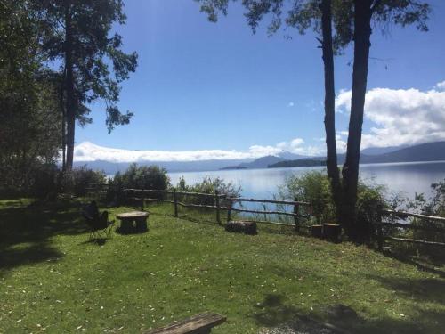a park with a view of a body of water at House on Calafquen lake in Panguipulli