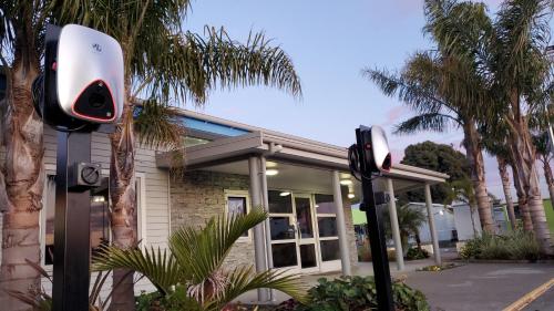 a pair of security cameras in front of a building at Kennedy Park Resort Napier in Napier