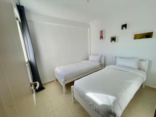 Ένα ή περισσότερα κρεβάτια σε δωμάτιο στο The cozy place, 5 min to airport